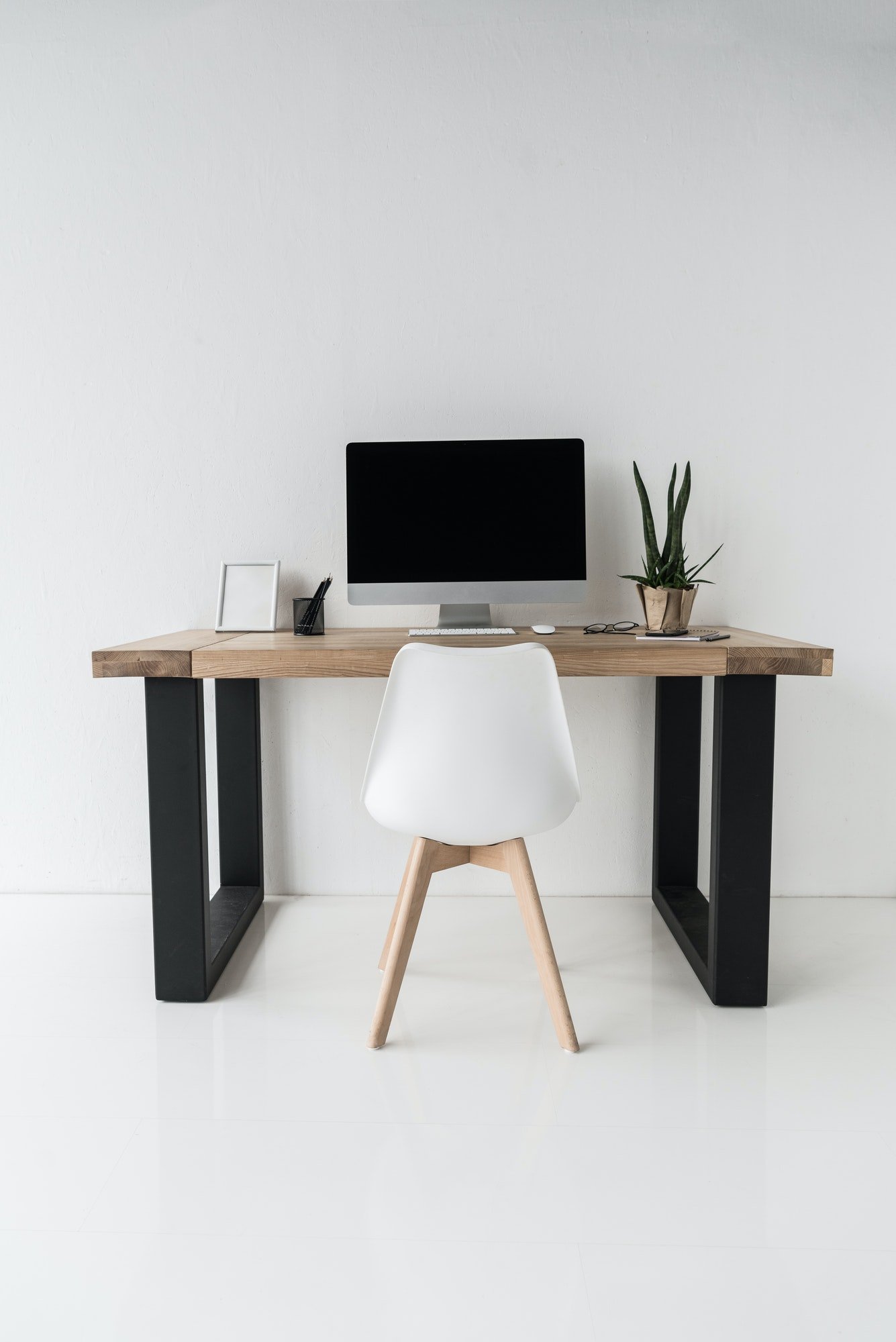 workplace-with-computer-and-stylish-furniture-in-modern-office